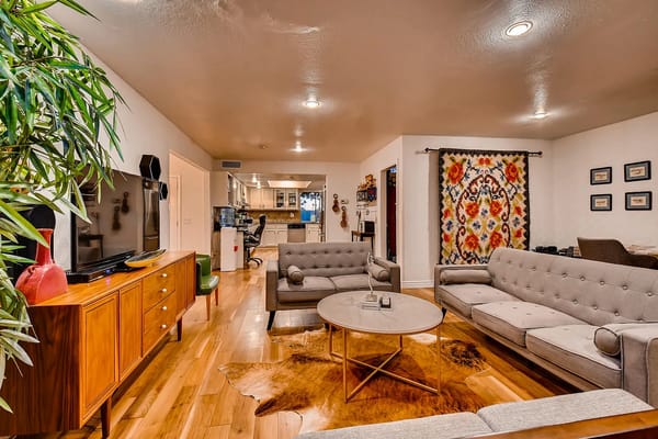 Spacious living room with comfortable seating and decorative elements