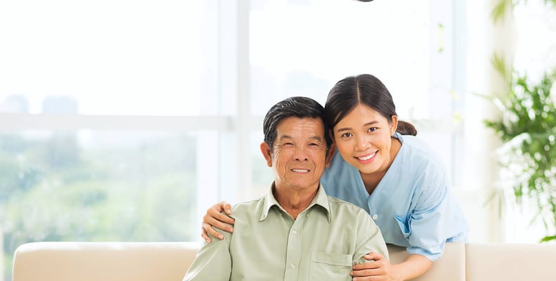 Caregiver with a resident in a bright lounge