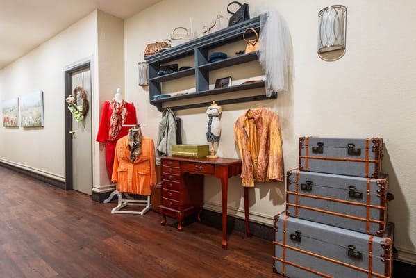 Decorative display of clothing and accessories in a hallway