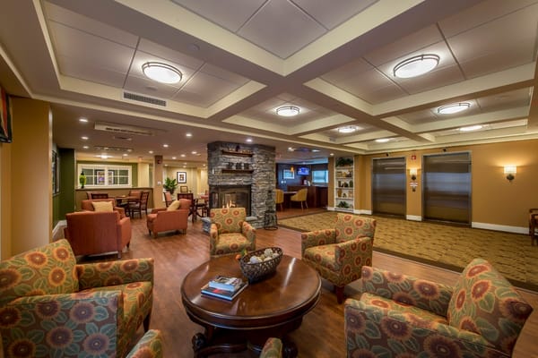 A cozy common area with seating and a fireplace