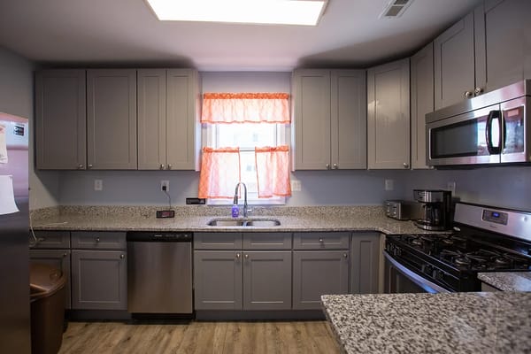 Modern kitchen interior with gray cabinets and a sink