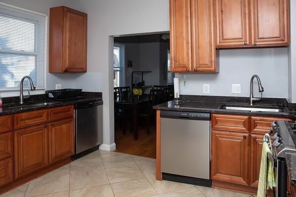 Interior image of a kitchen with cabinets and appliances
