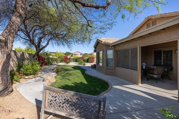 Well-maintained garden path leading to a residential area