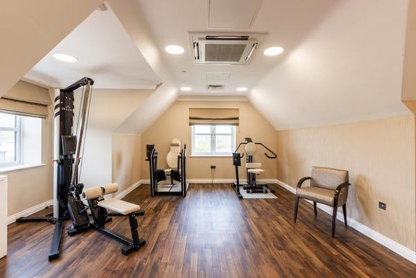 Small exercise room with gym equipment