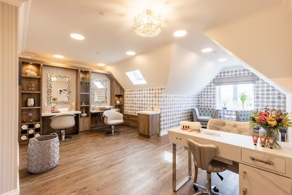 Bright salon interior with beauty stations and decor