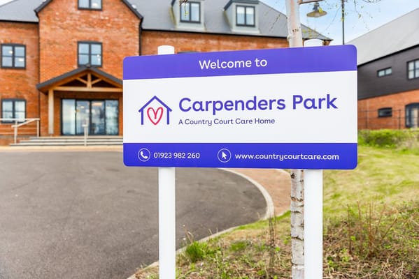 Welcome sign in front of Carpenders Park Care Home