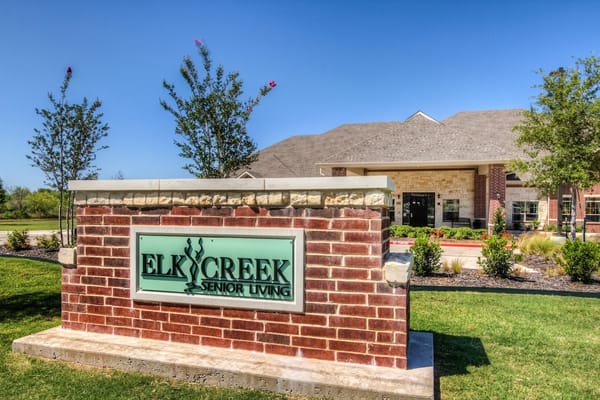 Exterior view of Elk Creek Senior Living sign and building