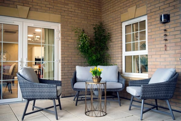 Outdoor seating area with plants and flowers