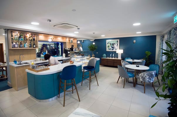 Modern common area with a café and seating.