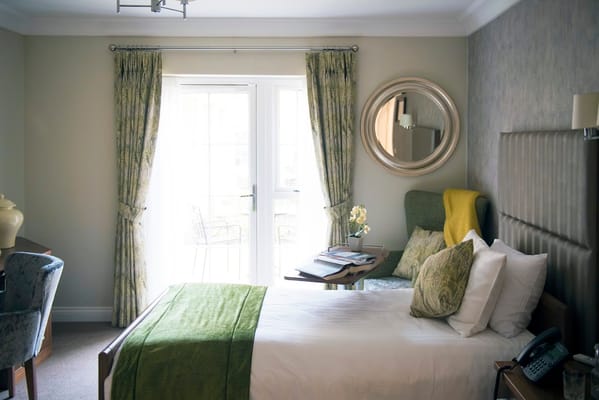 Cozy resident room with a bed and seating area