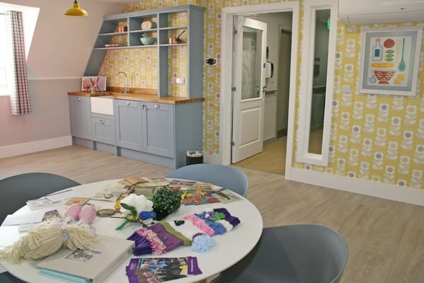 Bright common area with a table and decor