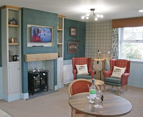 Cozy lounge area with seating and TV