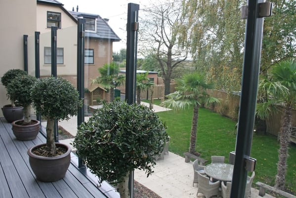 Outdoor garden space with trees and seating area