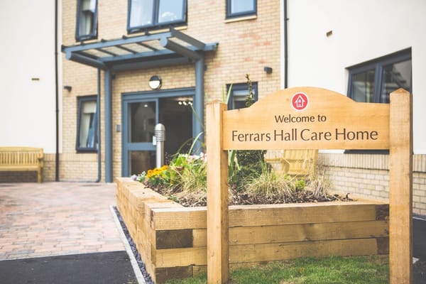 Building exterior with sign at Ferrars Hall Care Home
