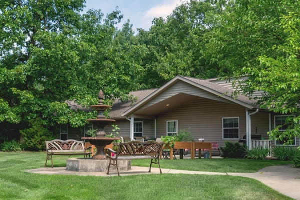 Outdoor view of a building with benches and a fountain
