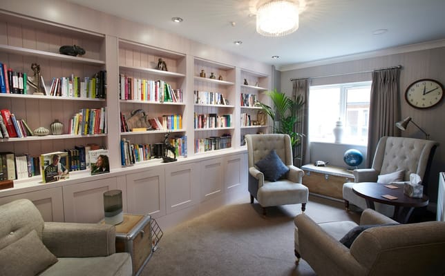 Cozy common area with bookshelves and seating