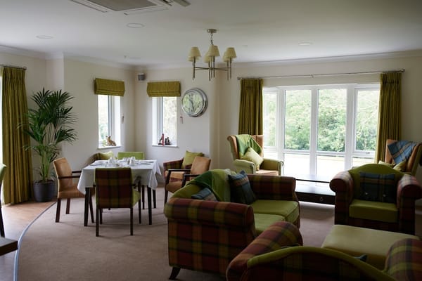Bright common area with seating and dining table
