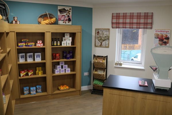Interior view of a small shop area with shelves