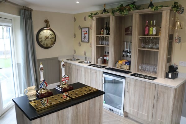 Interior view of a bar area with drinks and decor