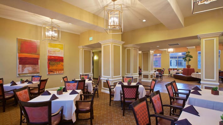 Dining room setup with tables and chairs