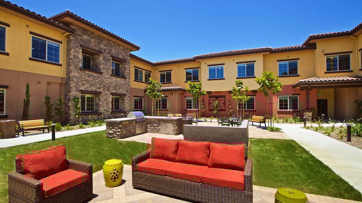 Outdoor courtyard with seating and landscape features