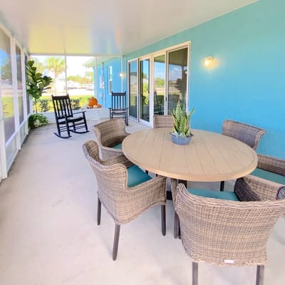 Outdoor seating area with a round table and chairs