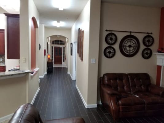 Interior hallway with brown couches and decor