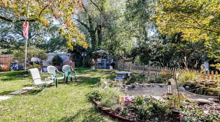 A serene garden area with seating and greenery