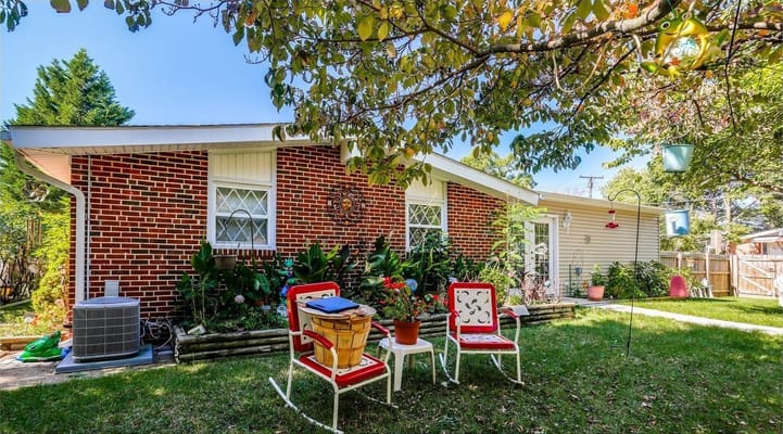 A sunny outdoor space with chairs and plants