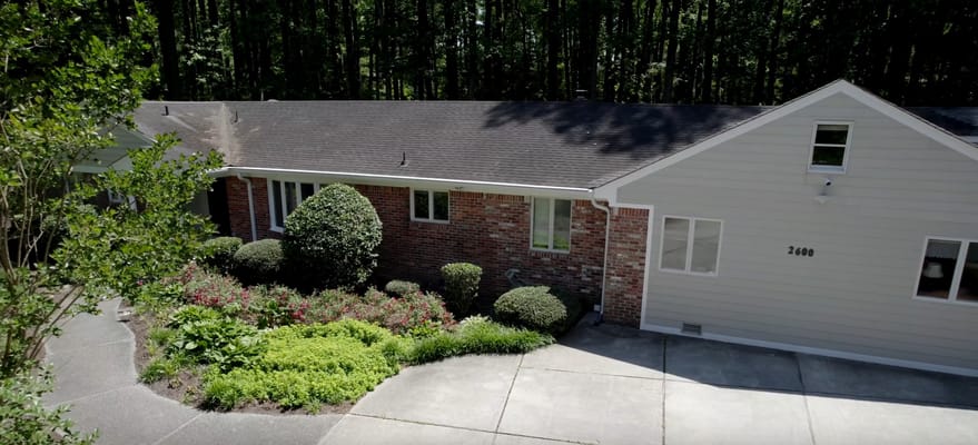 Exterior view of an assisted living facility with landscaping
