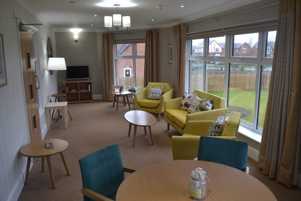 Bright interior common area with seating and windows