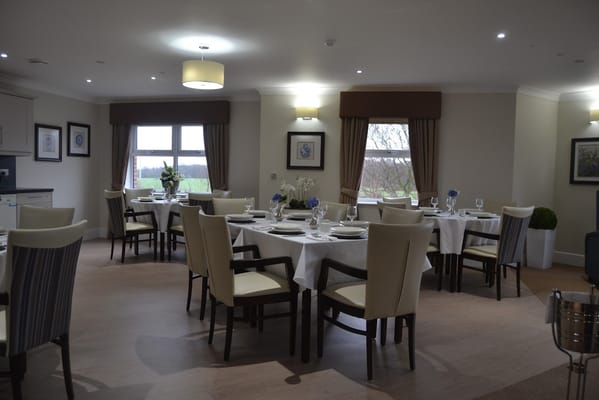 Bright dining area with elegantly set tables