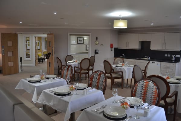 Dining area with tables set for a meal