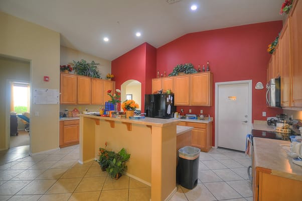 Bright kitchen area with flower decorations