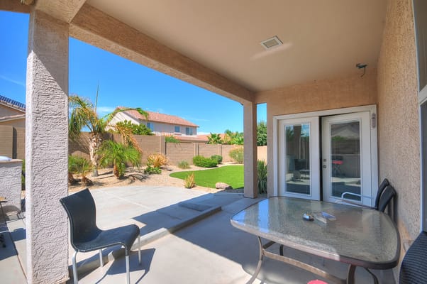 Outdoor patio area with seating and garden view