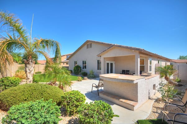 Well-maintained outdoor area with seating and landscaping