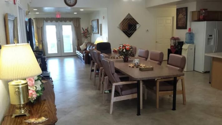 Bright common area with dining table and seating