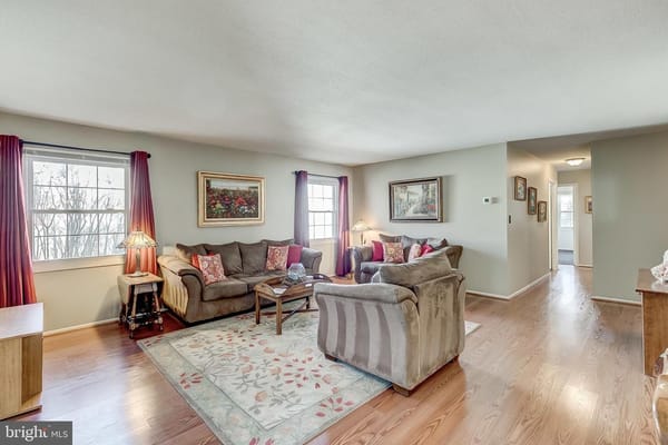 Spacious living room with comfortable seating and natural light