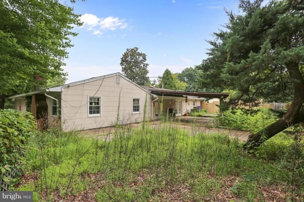 Exterior view of Ovalstone Comfort Home surrounded by greenery