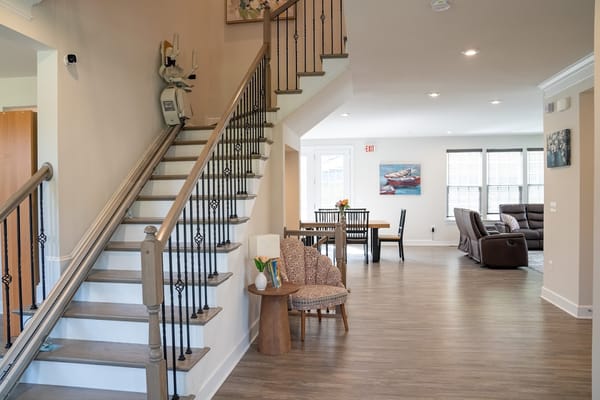 Bright common area with seating and dining space