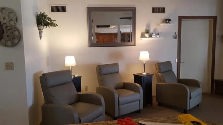 Comfortable lounge chairs with lamps and decor