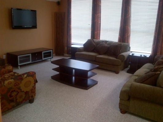 Common area with sofas and television.