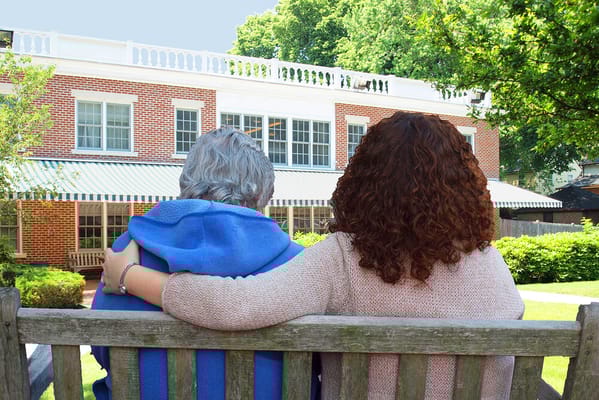 Two residents enjoying the outdoor space at Rogerson House