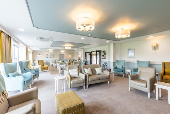 Cozy lounge area in Ruckland Court Care Home featuring comfortable seating