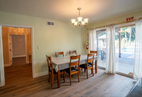 Dining area with a view of the pool outside