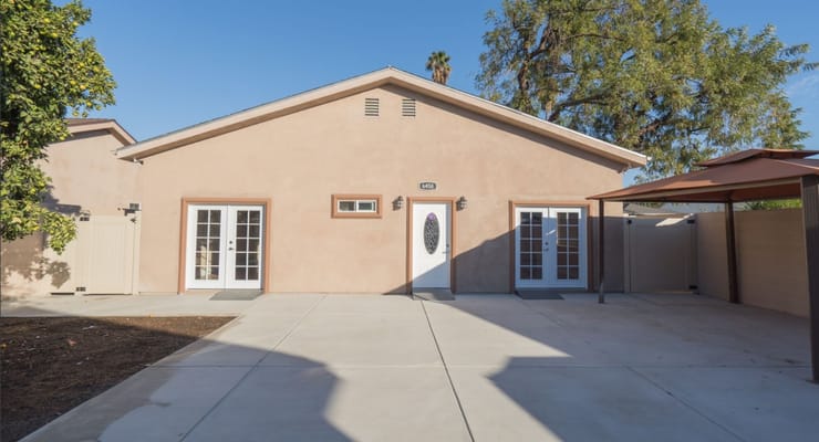 Exterior of Sweet Home Senior Living facility showcasing the entrance and surrounding area.