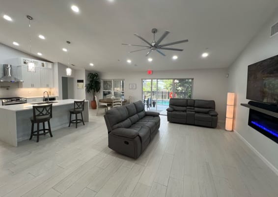 Cozy common area with modern seating and a view of the pool
