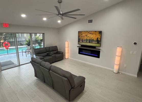 Bright common area with seating and a view of the pool
