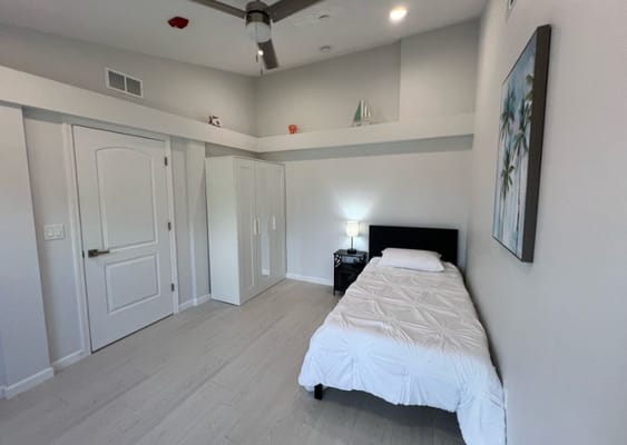 Private room with a bed and closet