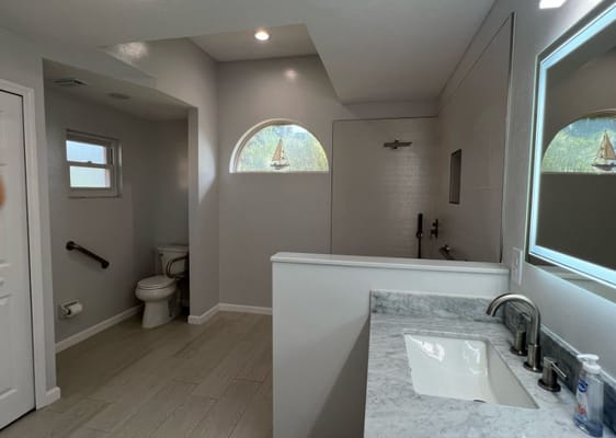Modern bathroom with a walk-in shower and marble countertop